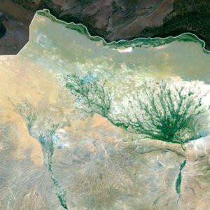 Satellite view of Afghanistan highlighting mountain ranges and desert plains.