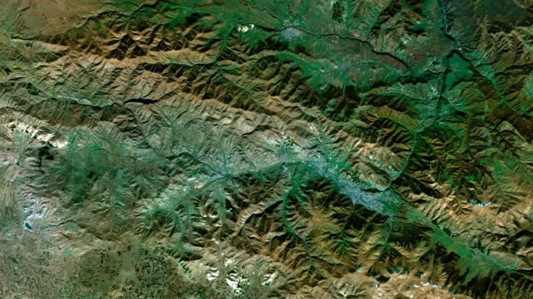 Satellite view of Armenia highlighting mountainous regions and lush valleys.