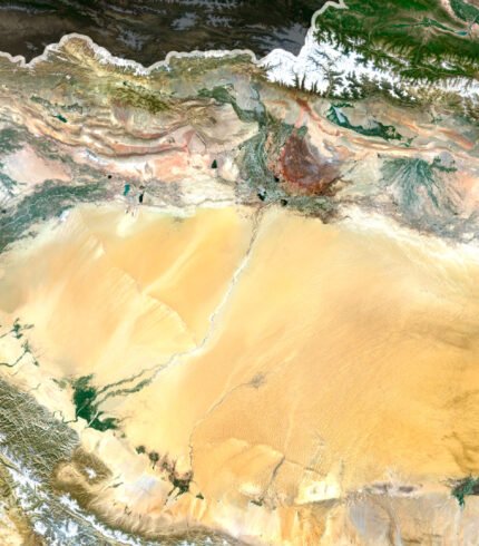 Satellite view of China highlighting the Himalayan mountains and vast plains.