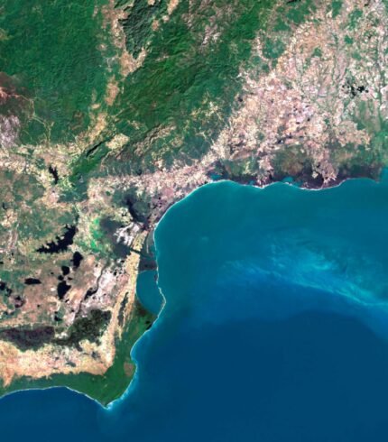 Satellite view of Cuba highlighting coastal areas and inland regions.