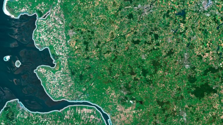 Satellite view of Germany highlighting the Alps and coastal regions.