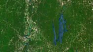 Satellite view of Massachusetts highlighting coastal areas and inland forests.