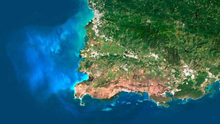 Satellite view of Puerto Rico highlighting coastal areas and mountainous regions.