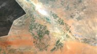 Saudi Arabia satellite view highlighting vast deserts and coastal regions.