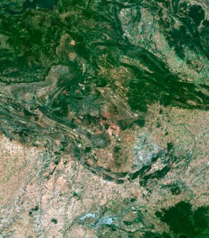 Satellite view of Spain highlighting coastal regions and inland landscapes.