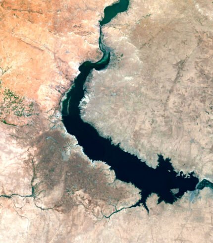 Satellite view of Syria highlighting both natural landscapes and urban areas.