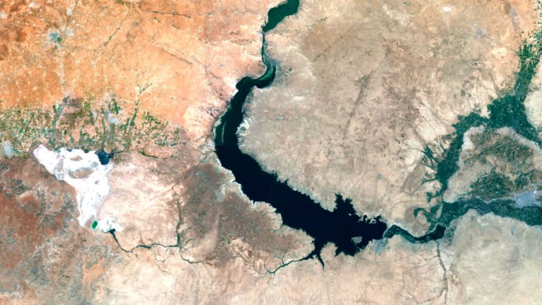 Satellite view of Syria highlighting both natural landscapes and urban areas.