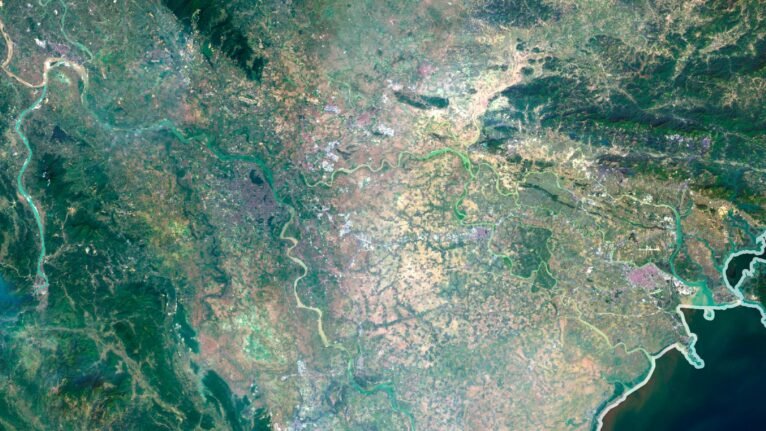 Vietnam satellite view highlighting coastal areas and inland landscapes.