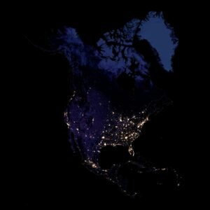 High-resolution satellite image of North America at night, showing illuminated urban areas and coastlines.