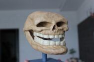 Close-up of 3D-printed Troll Face teeth with exaggerated details for a menacing grin.